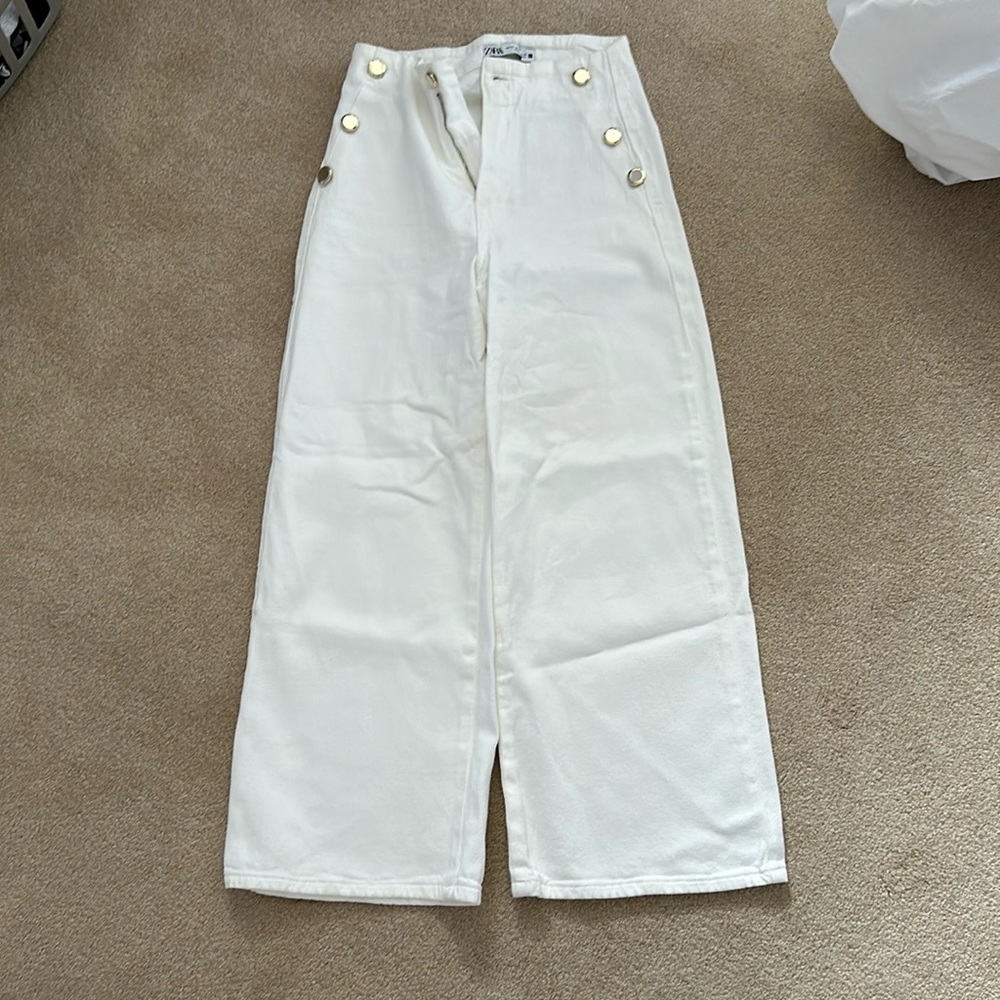 Zara flared white jeans with gold buttons
